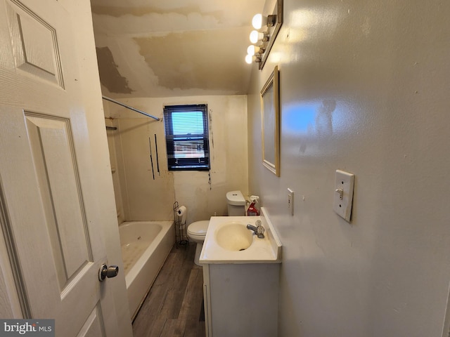 full bathroom featuring  shower combination, hardwood / wood-style flooring, vanity, and toilet