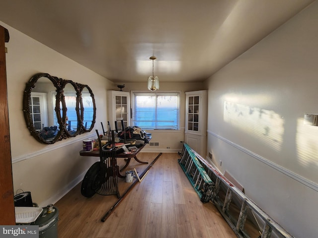 workout room with wood-type flooring