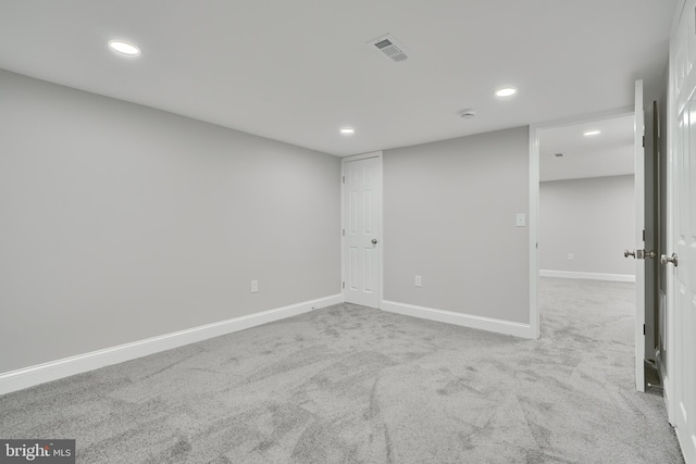 spare room with light colored carpet