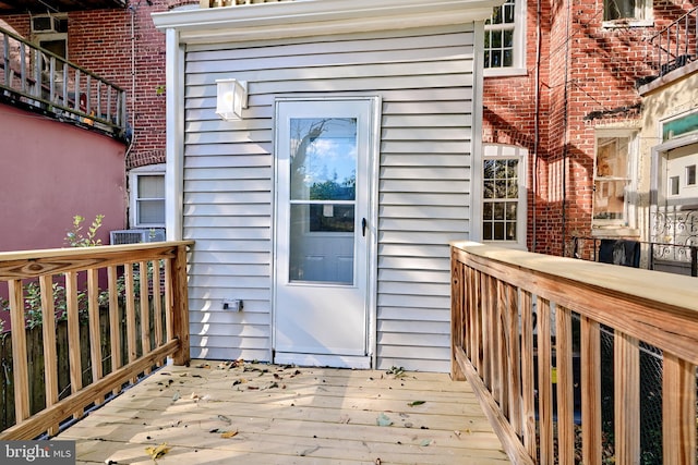 doorway to property featuring a wooden deck