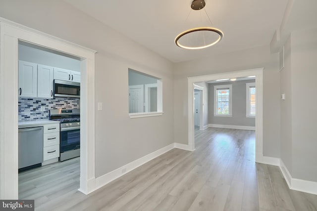 hallway featuring light hardwood / wood-style floors