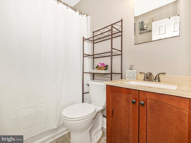 bathroom with toilet, vanity, tile patterned floors, and a shower with shower curtain