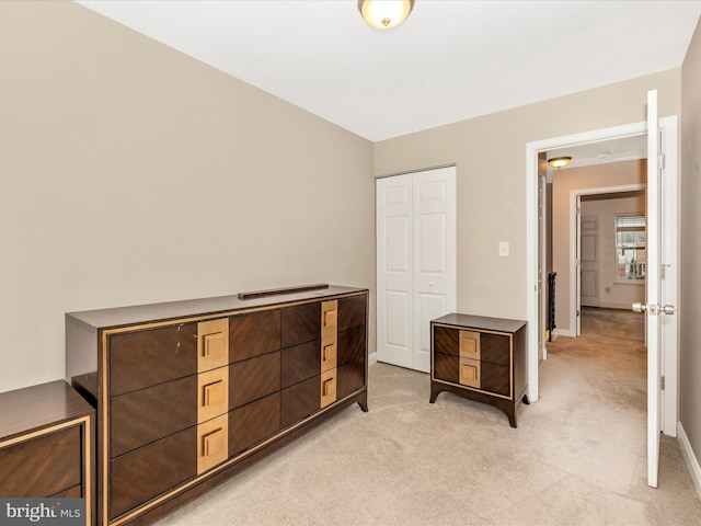 carpeted bedroom with a closet