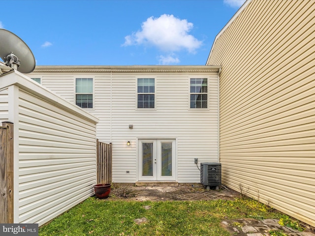 back of house featuring french doors and cooling unit