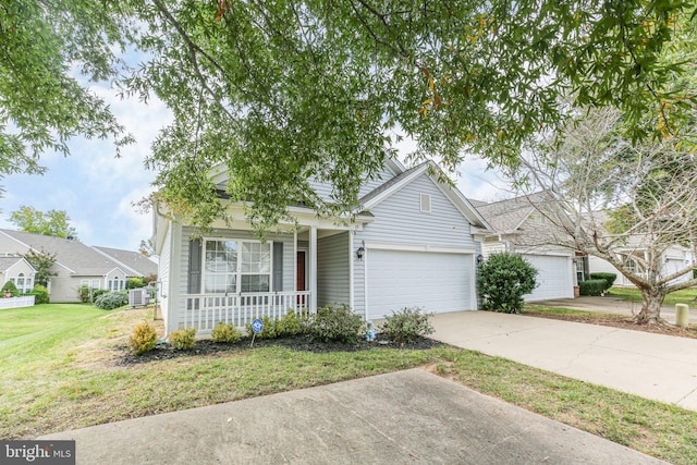 view of front of house with a garage, a porch, and a front lawn