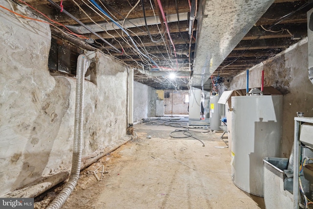unfinished below grade area featuring water heater, electric water heater, and heating unit