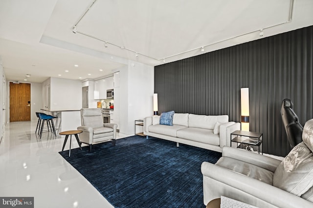 living room featuring rail lighting