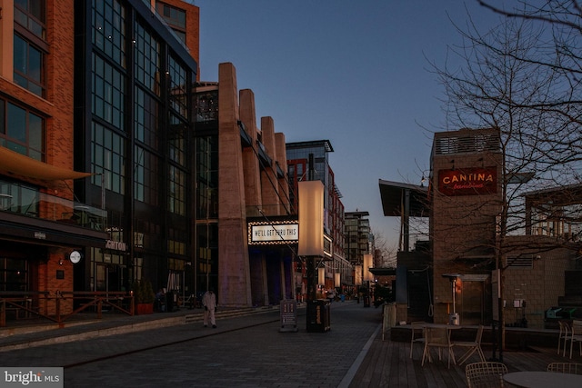 view of outdoor building at dusk