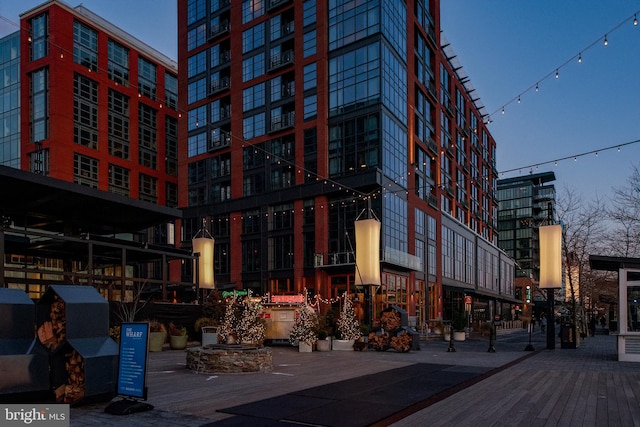 view of outdoor building at dusk