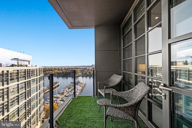 balcony featuring a water view