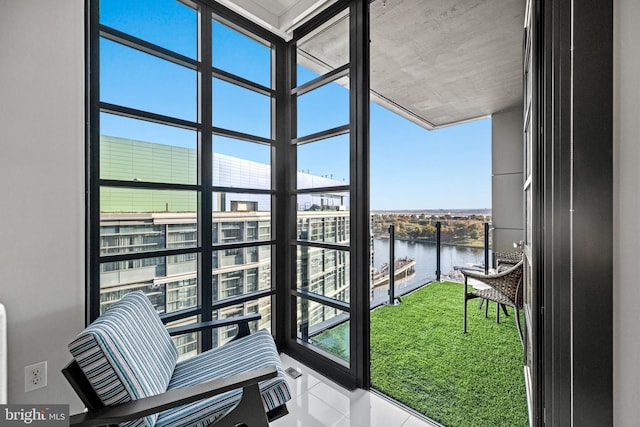 balcony featuring a water view