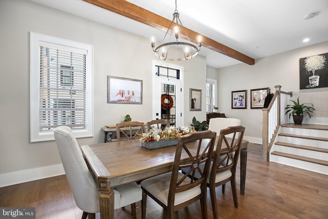 dining room featuring a chandelier, beam ceiling, and dark hardwood / wood-style flooring