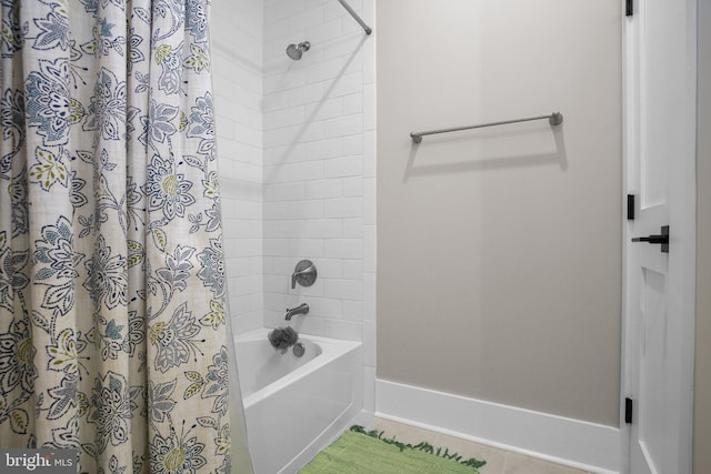 bathroom with shower / bathtub combination with curtain and tile patterned floors