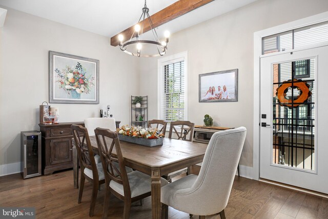 dining area featuring wine cooler, dark hardwood / wood-style floors, and a chandelier