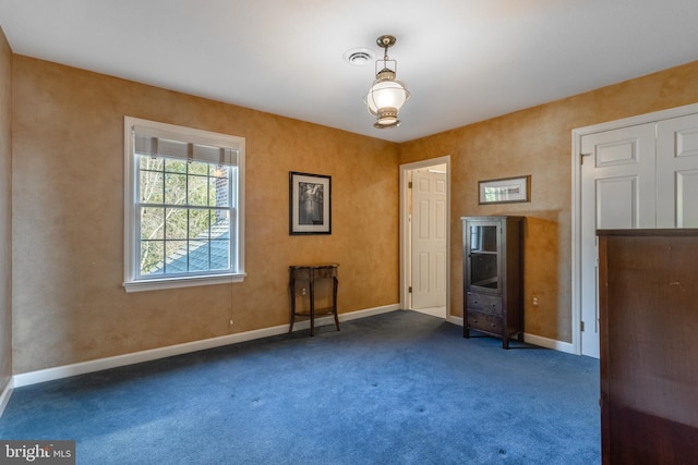 interior space with baseboards and visible vents