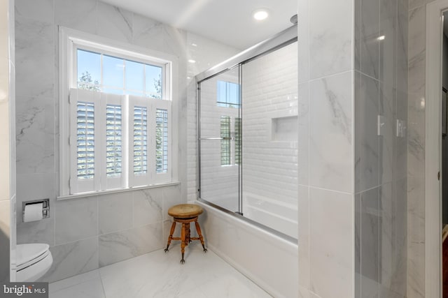 bathroom with recessed lighting, tile walls, and toilet