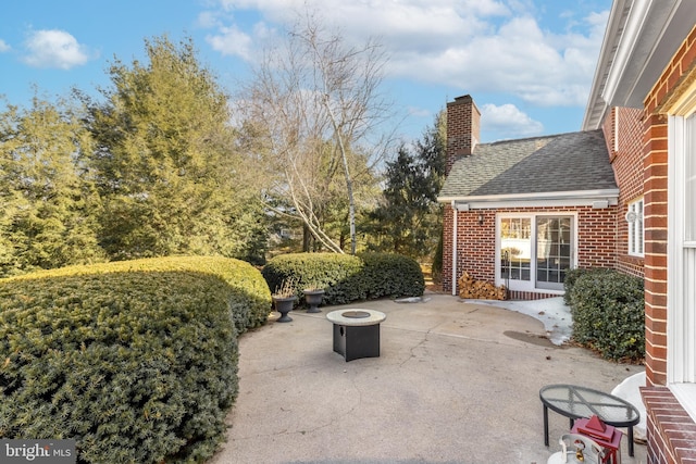 view of patio / terrace with an outdoor fire pit