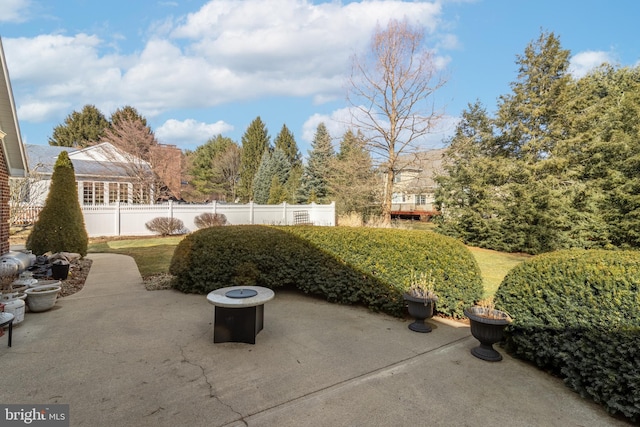 view of patio featuring fence