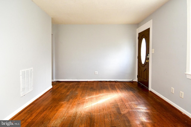 foyer entrance with dark wood-type flooring