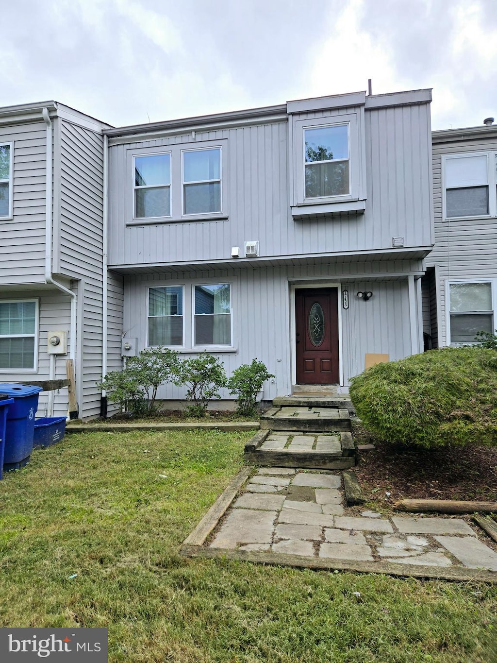 view of property with a front lawn