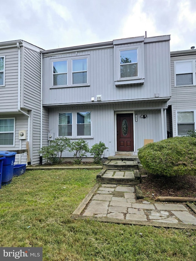 view of property with a front lawn