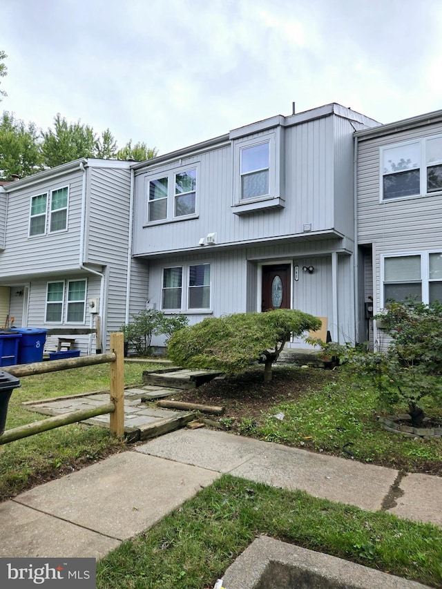 view of property featuring a front yard