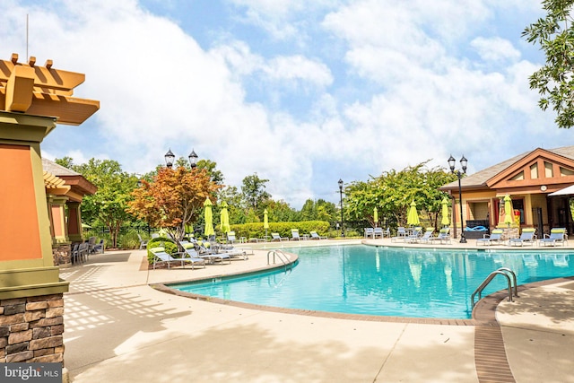 view of swimming pool with a patio