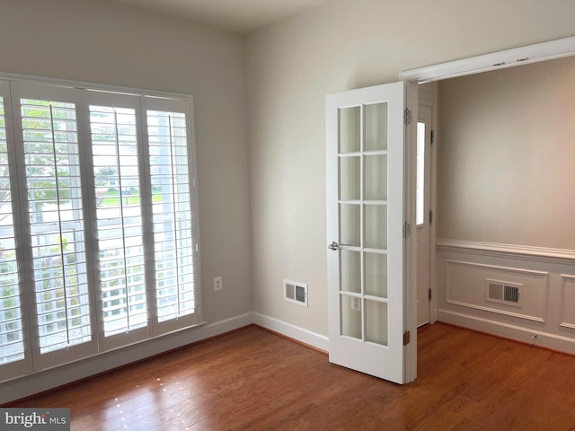 empty room with wood-type flooring