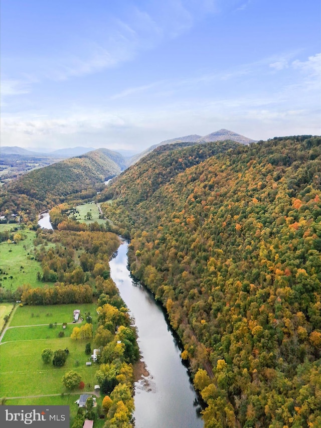 drone / aerial view with a water and mountain view