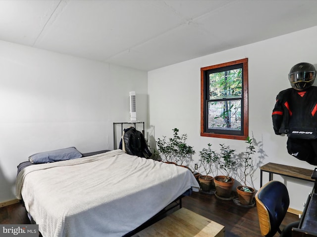 bedroom with wood-type flooring