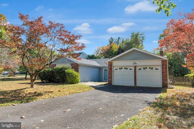 ranch-style home featuring a garage