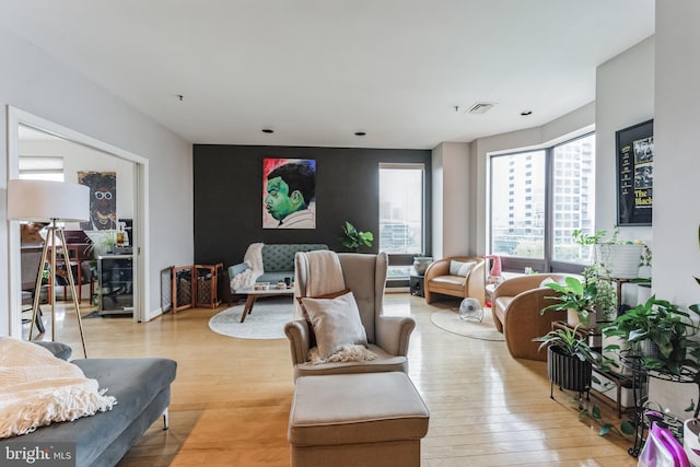 living room with light hardwood / wood-style flooring