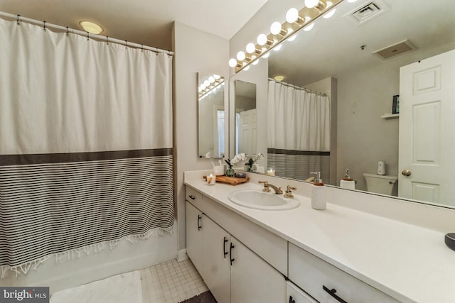 full bathroom with vanity, tile patterned flooring, toilet, and shower / tub combo with curtain