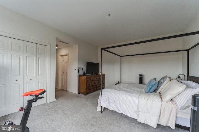 carpeted bedroom with a closet