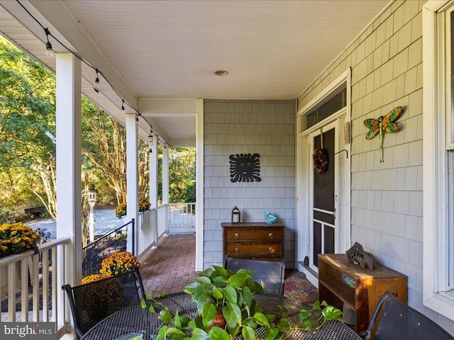 view of patio featuring a porch