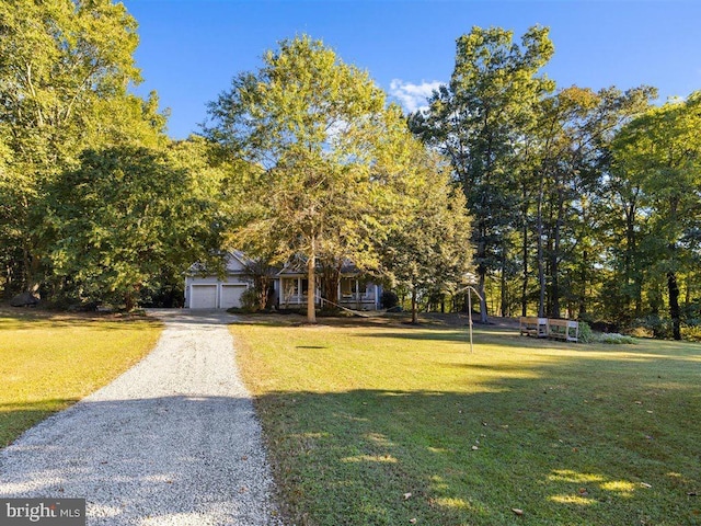 view of front facade with a garage and a front yard