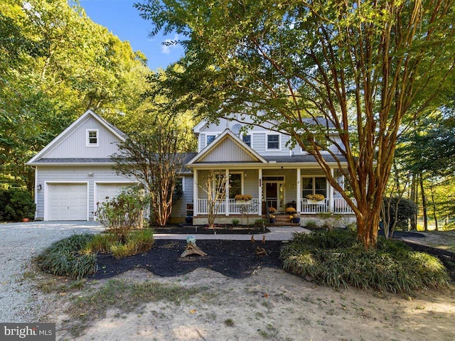 view of front of home with a porch and a garage