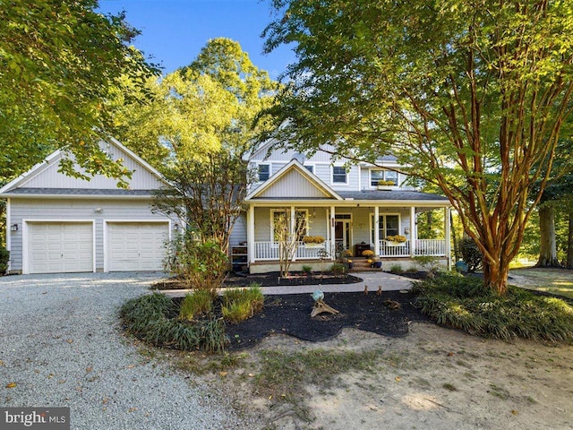 view of front of property with a porch and a garage