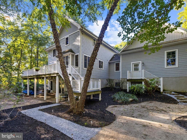 view of front of home with a wooden deck