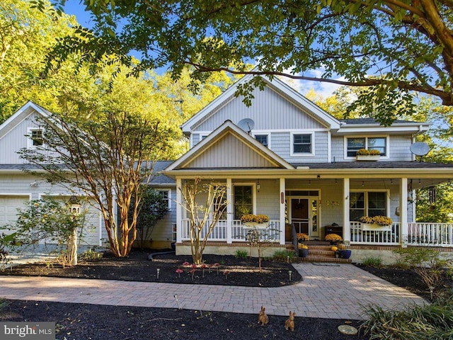 view of front of house featuring a garage and covered porch