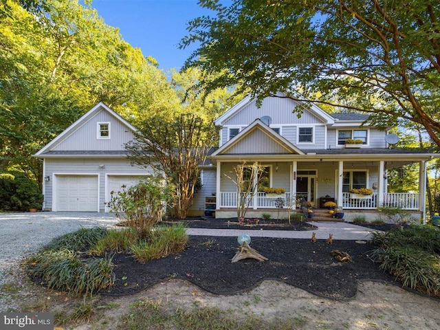 view of front of house featuring a garage and a porch