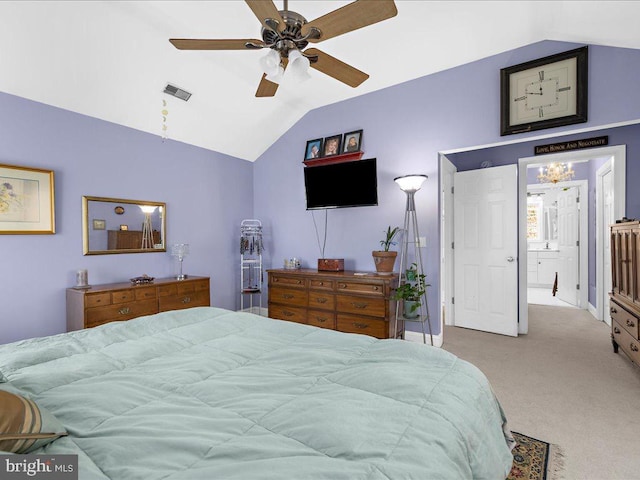 carpeted bedroom with vaulted ceiling and ceiling fan