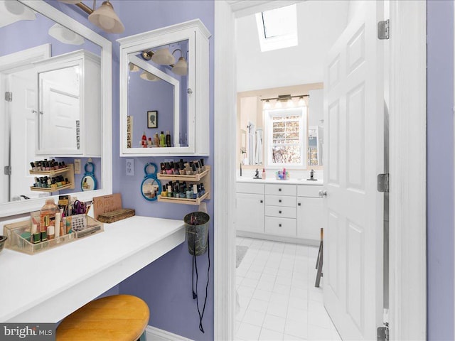 bathroom with vanity and tile patterned floors