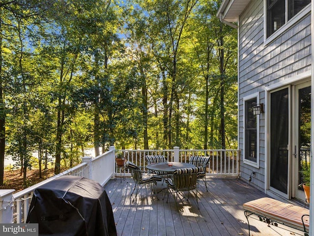 wooden terrace with area for grilling