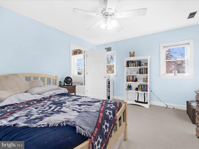 carpeted bedroom featuring ceiling fan