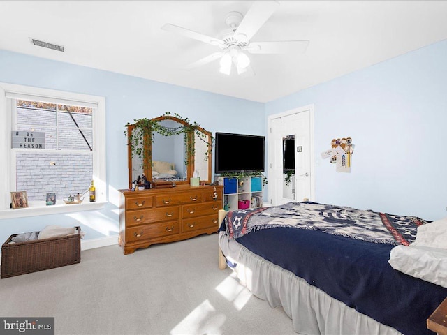 bedroom featuring ceiling fan and carpet flooring