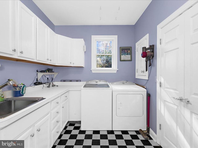 laundry room featuring cabinets, sink, electric panel, and independent washer and dryer