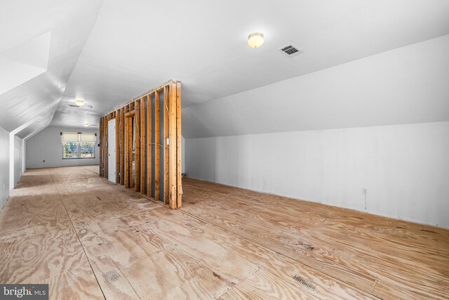 bonus room featuring vaulted ceiling