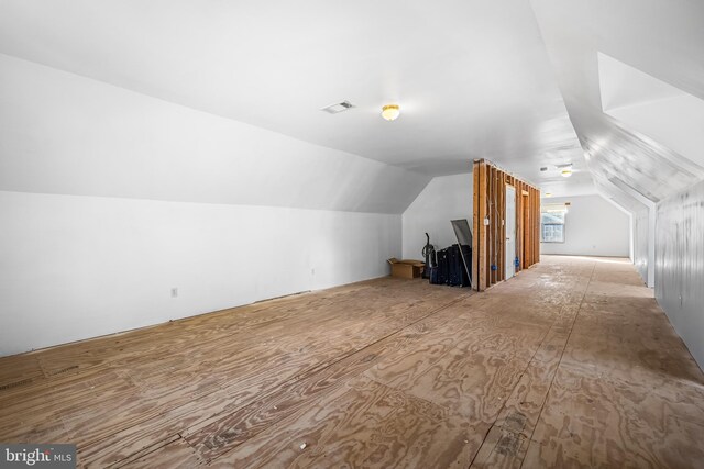 additional living space featuring vaulted ceiling