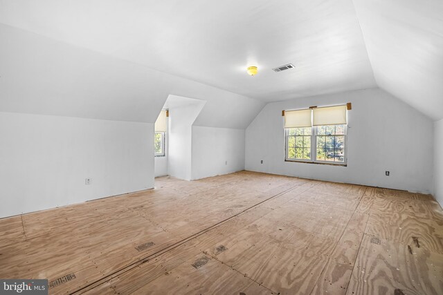 bonus room with vaulted ceiling